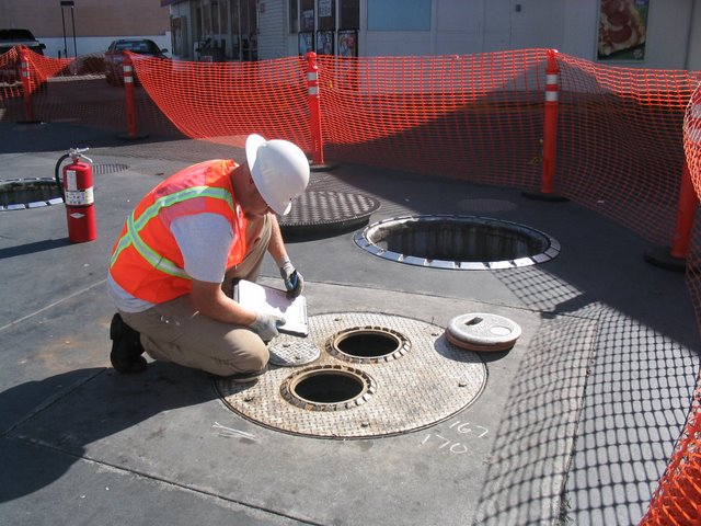 Class A/B UST Operator inspecting UST spill buckets
